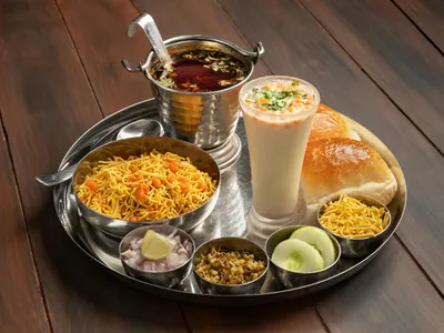 Wholesome Indian meal with jeera rice, masoor dal, bhindi masala, and fresh salad